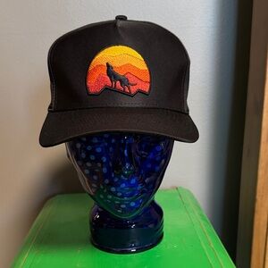 Black Trucker Hat with Sunset Wolf Patch